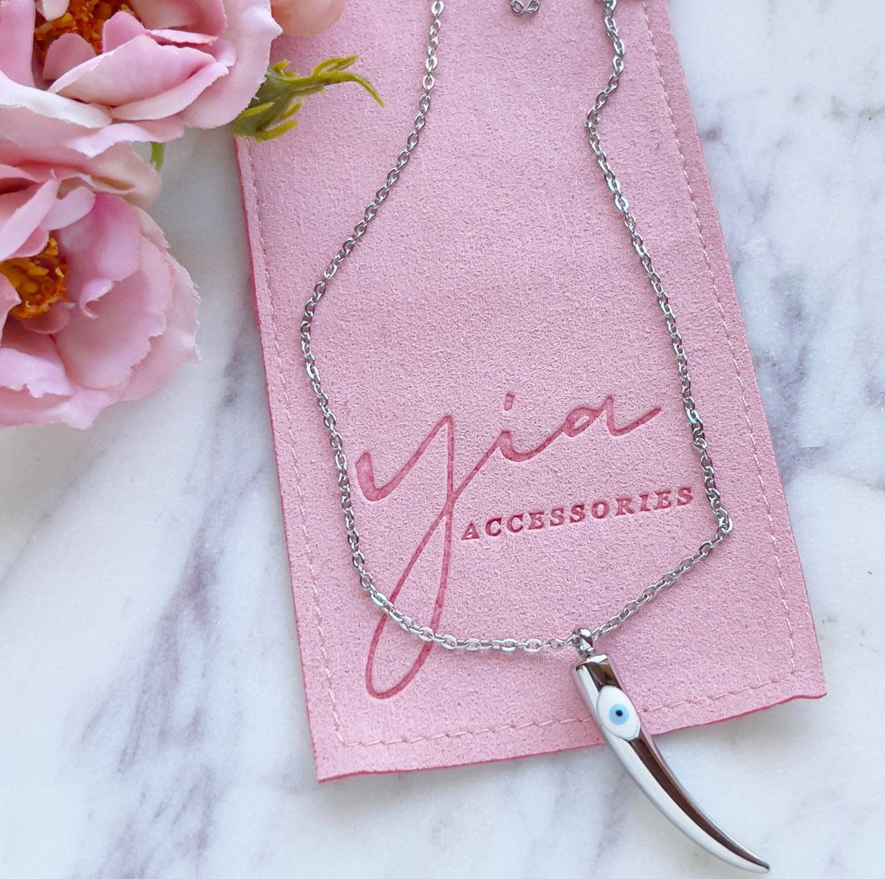 White Evil Eye Saber Tooth necklace